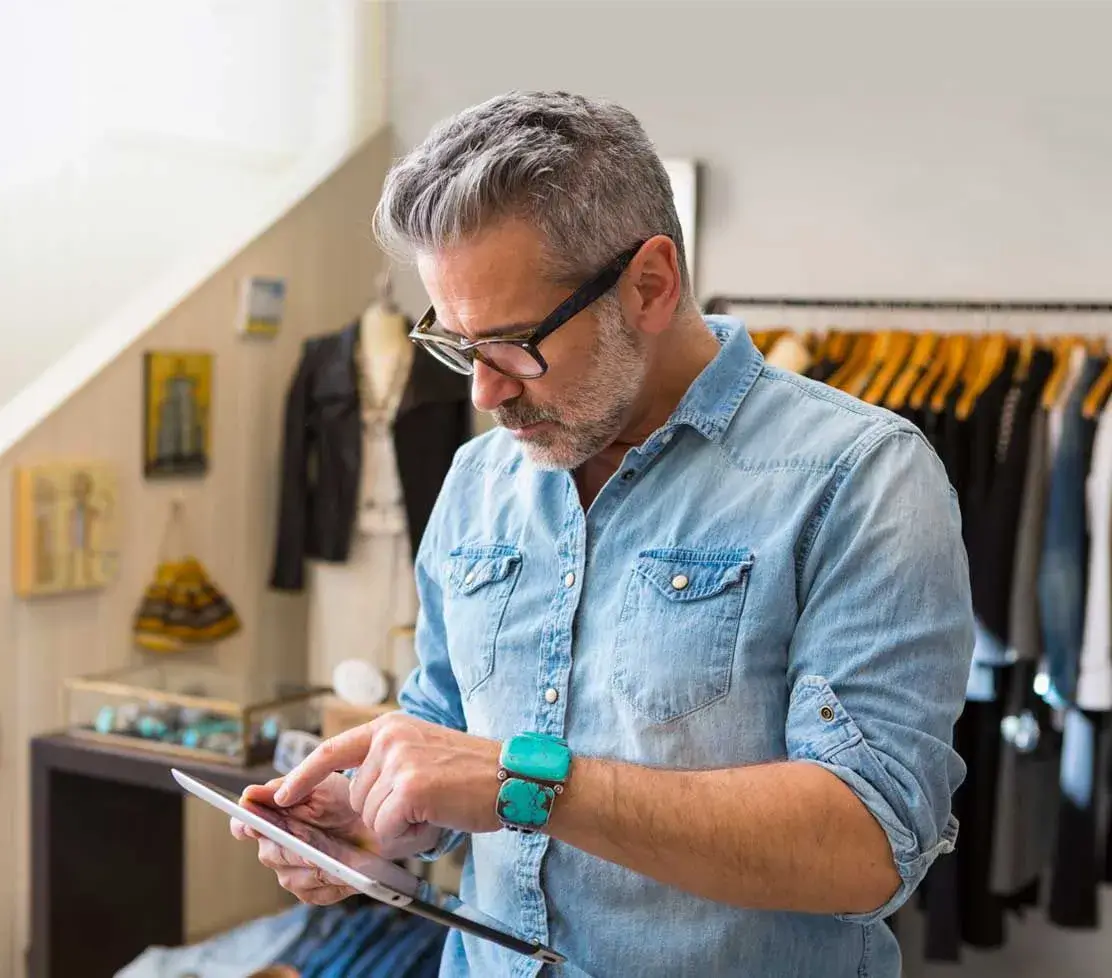 A man using a tablet device