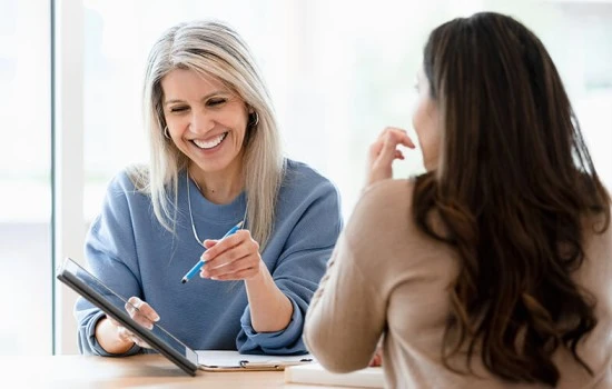 A woman meeting with her financial advisor